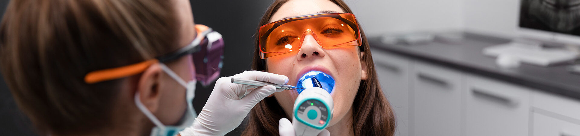 Girl seating at Concord periodontics during Laser treatment